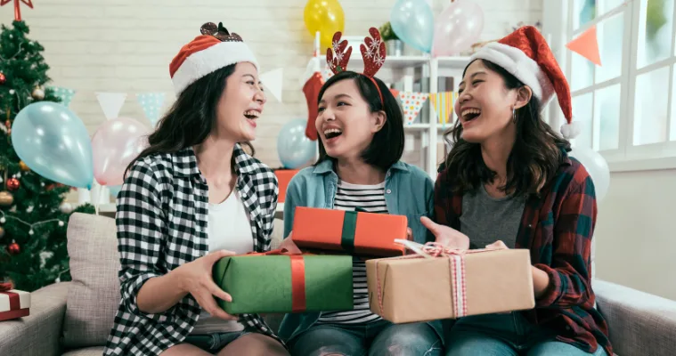 Image of friends exchanging Christmas gifts