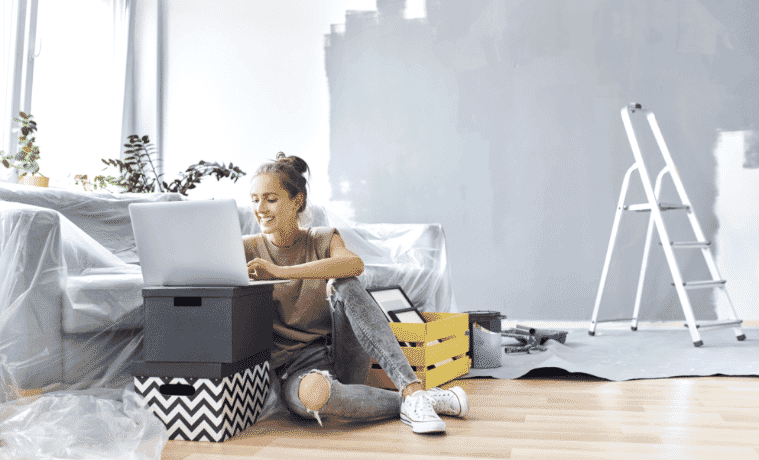 Happy woman moving into new house 