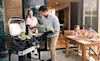 Family enjoying using their BBQ and outdoor area