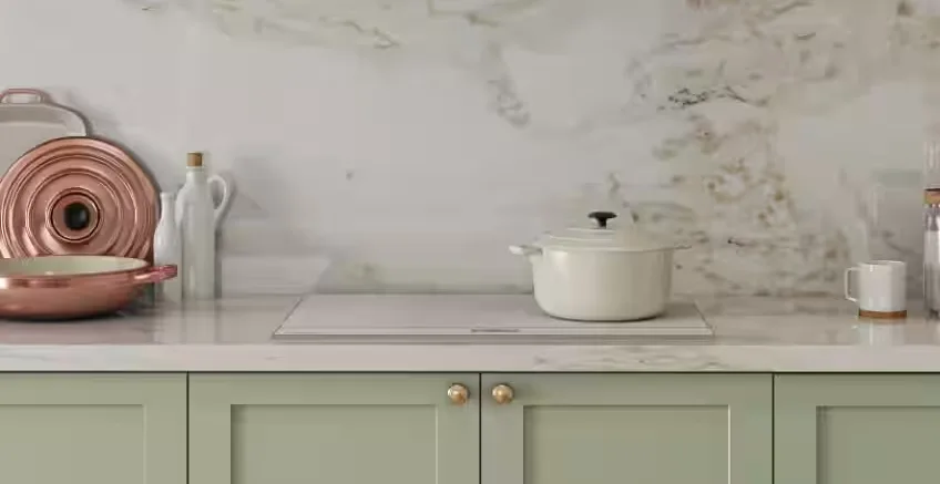 White induction cooktop from samsung on white marble bench