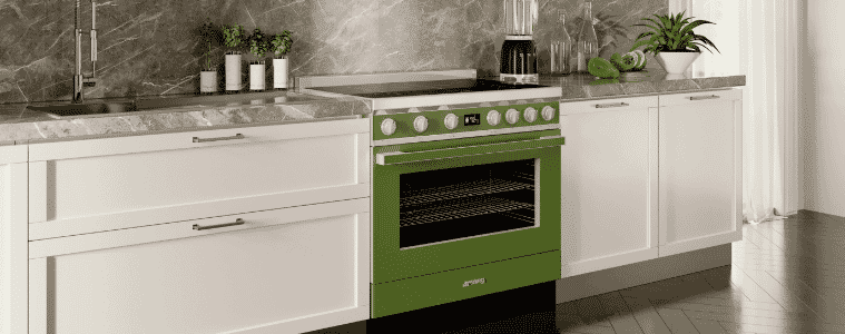 A green Smeg Portofino freestanding cooker in a white and grey modern kitchen