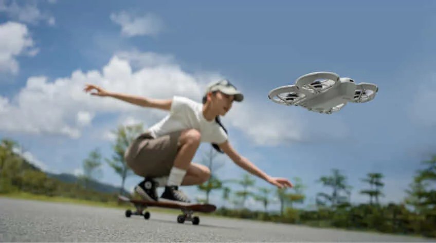 woman skateboards next to DJI Neo drone