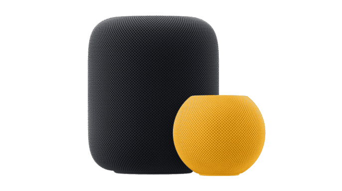Midnight coloured HomePod situated behind a yellow HomePod mini