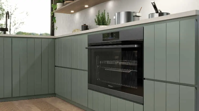 A builtin Westinghouse oven in a green kitchen