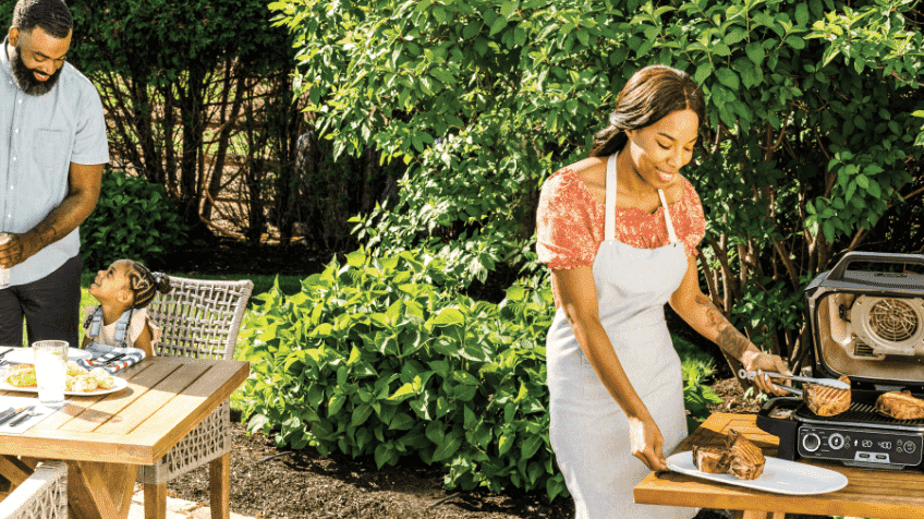 Family cooking outside with Ninja