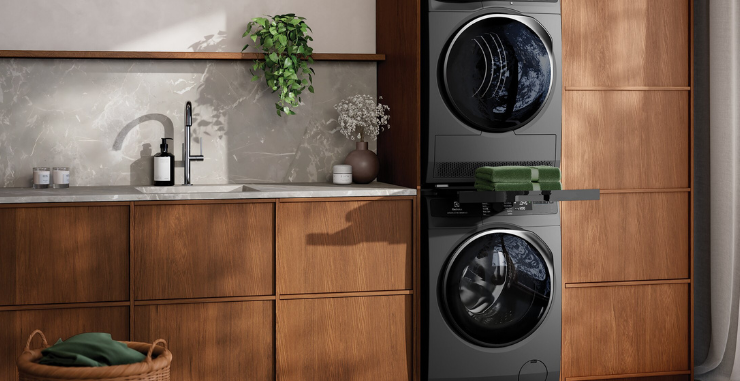 Electrolux matching washer and dryer in a modern laundry with wooden cabinetry