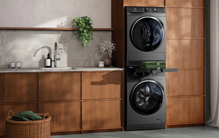 Electrolux matching washer and dryer in a modern laundry with wooden cabinetry