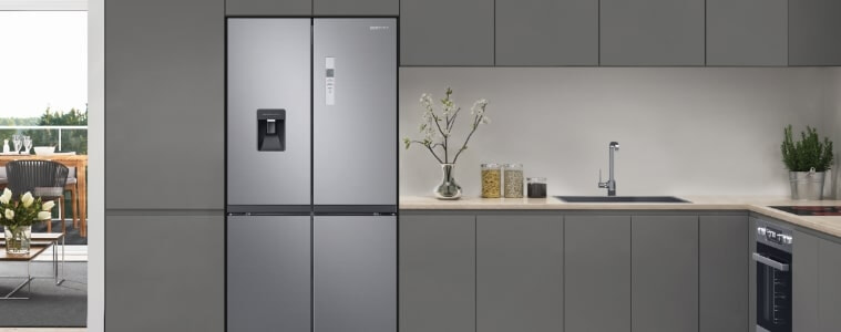 A slimline fridge in a grey kitchen