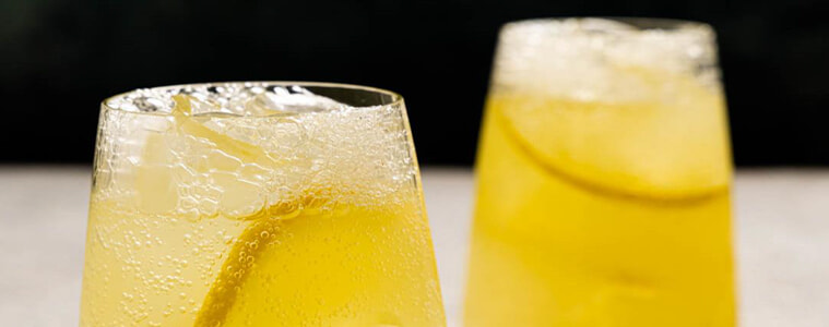 A closeup of the two glasses of lemonade made with the Breville InFizz Fusion