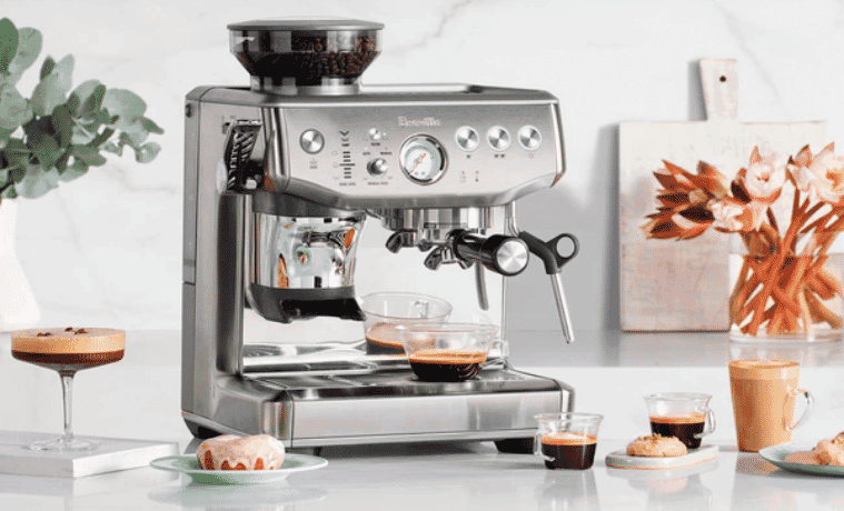Breville Barista Express Impress Coffee Machine in white modern kitchen with espressos 