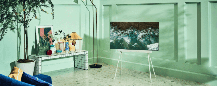 LG OLED TV in a bright room on a serif stand