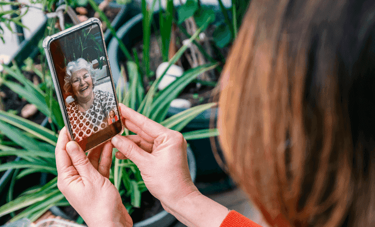 Woman video calling her mum on a mobile phone