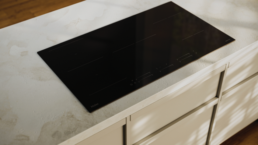 Woman closing and starting her Haier top load washer