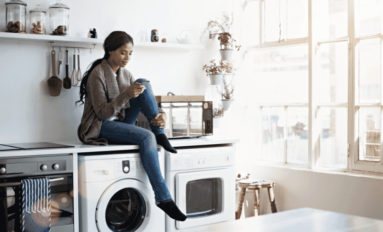 A woman waits for her washing to be finished