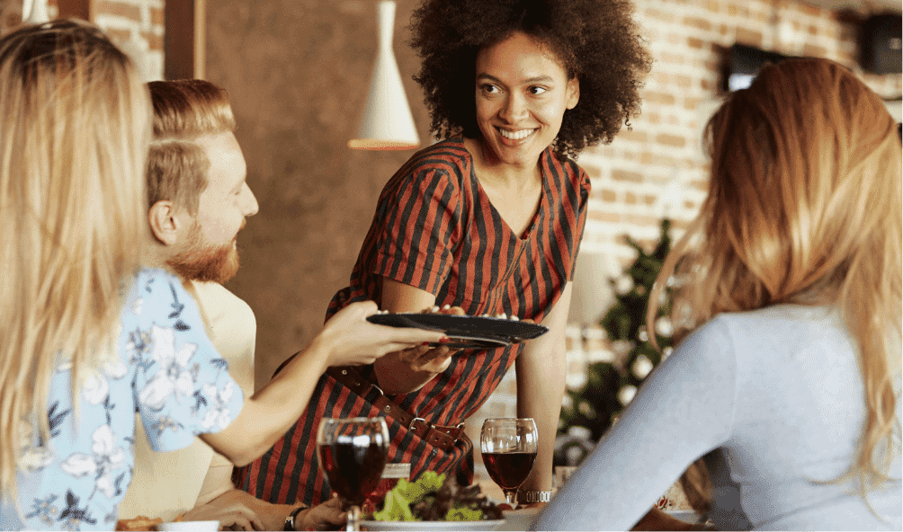 Woman serving cooking made in omega cooking suite