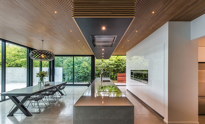 A large modern seamless kitchen full of Schweigen appliances
