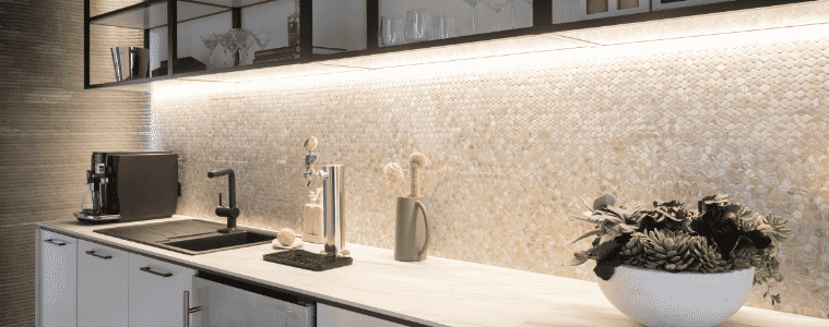 Butlers pantry with mosaic tiled splashback overhead open shelves builtin bar fridge and benchtop coffee machine