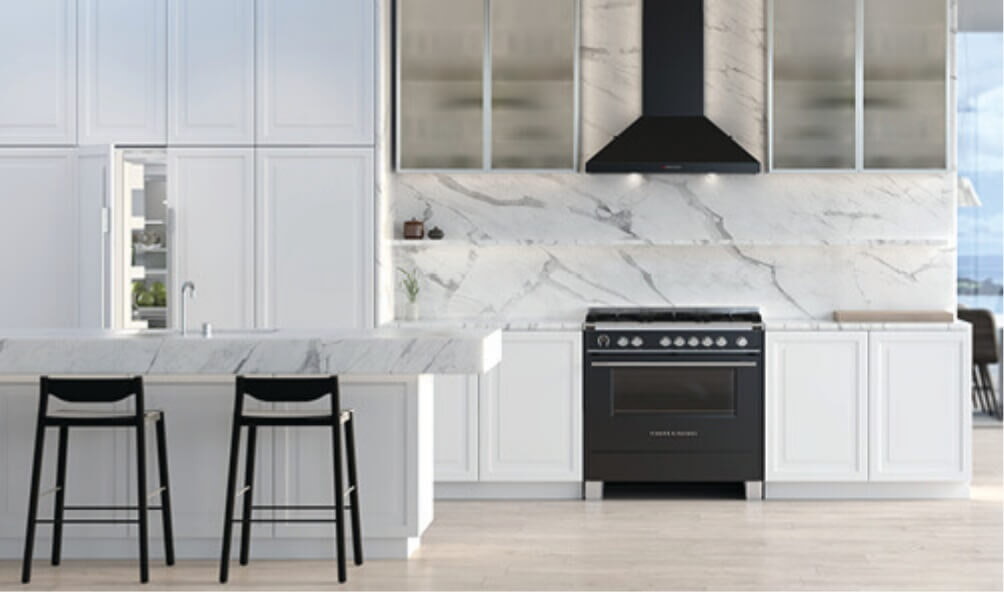 A black Fisher  Paykel freestanding oven and rangehood in a modern white kitchen