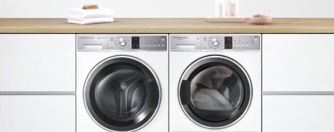 A washer and dryer sit sidebyside in a laundry