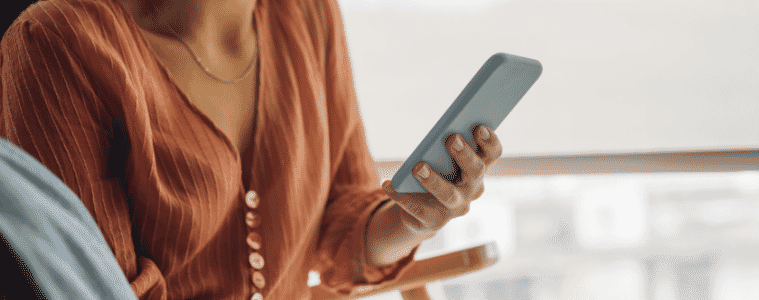 woman looking at her mobile phone 