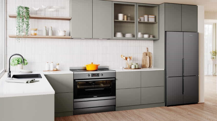 A Westinghouse freestanding oven in a white and sage green kitchen