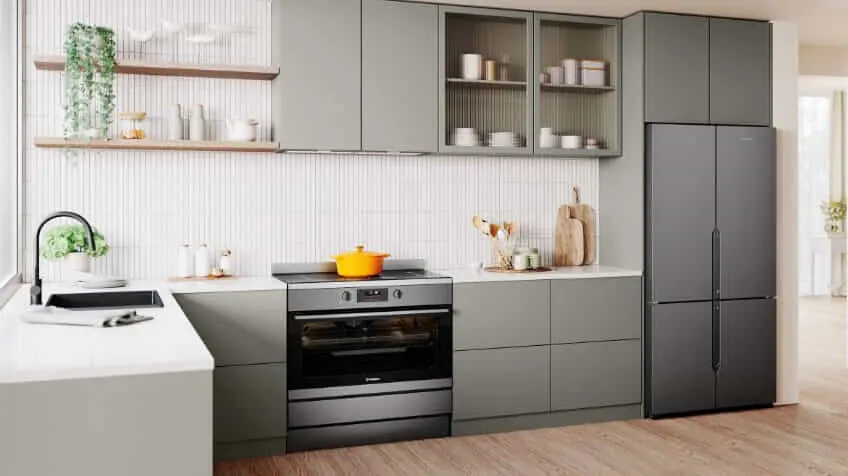 A Westinghouse freestanding oven in a white and sage green kitchen
