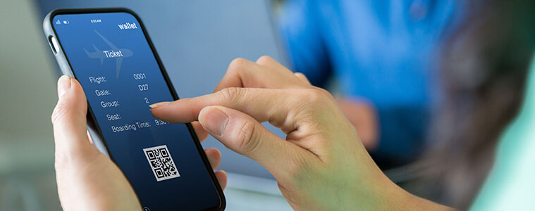 Woman uses a smartphone to make flight reservations