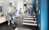 a man vacuuming his house using the Bosch Unlimited 7 Vacuum 
