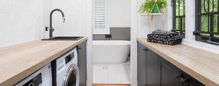 A galley laundry adjoins a bathroom