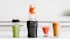 Image of smoothies and shakes lined up on a benchtop next to the Ninja Nutri Precision Blender Mega Pack