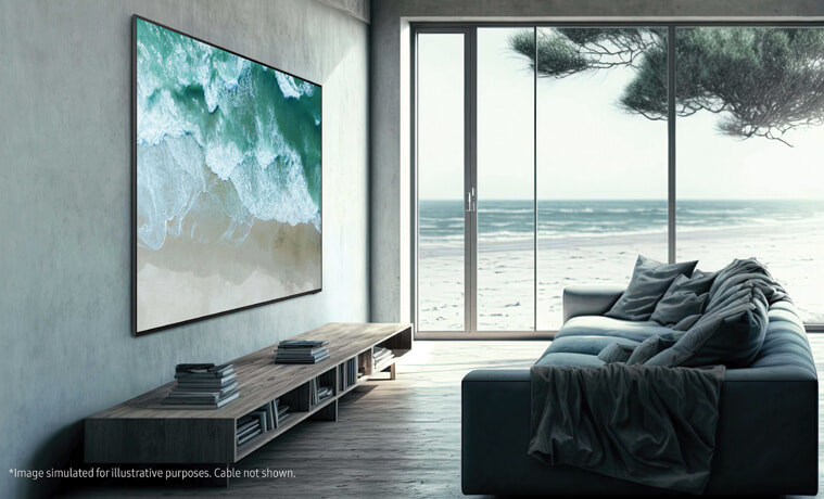 A large TV mounted to the wall of a neutral toned modern living room by the beach