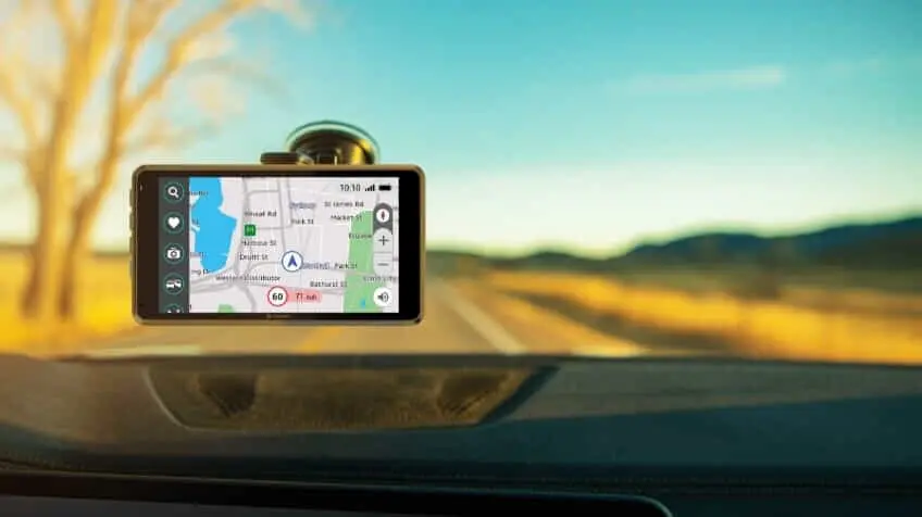 A Navman GPS attached to the windscreen of a car