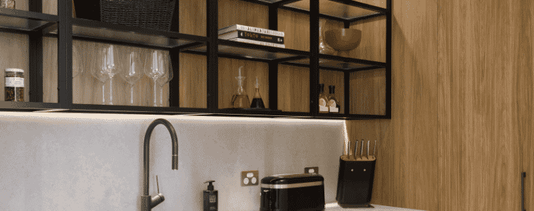 Benchtop with appliances and accessories in a modern industrial kitchen