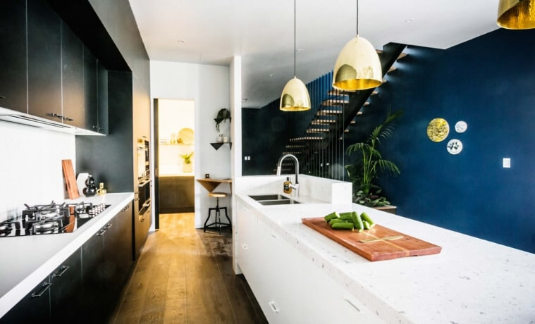 A dualtoned black and white galley kitchen