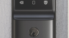eufy smart door lock mounted to outside door