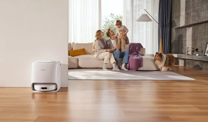 Lifestyle image of narwal robot vacuum and family