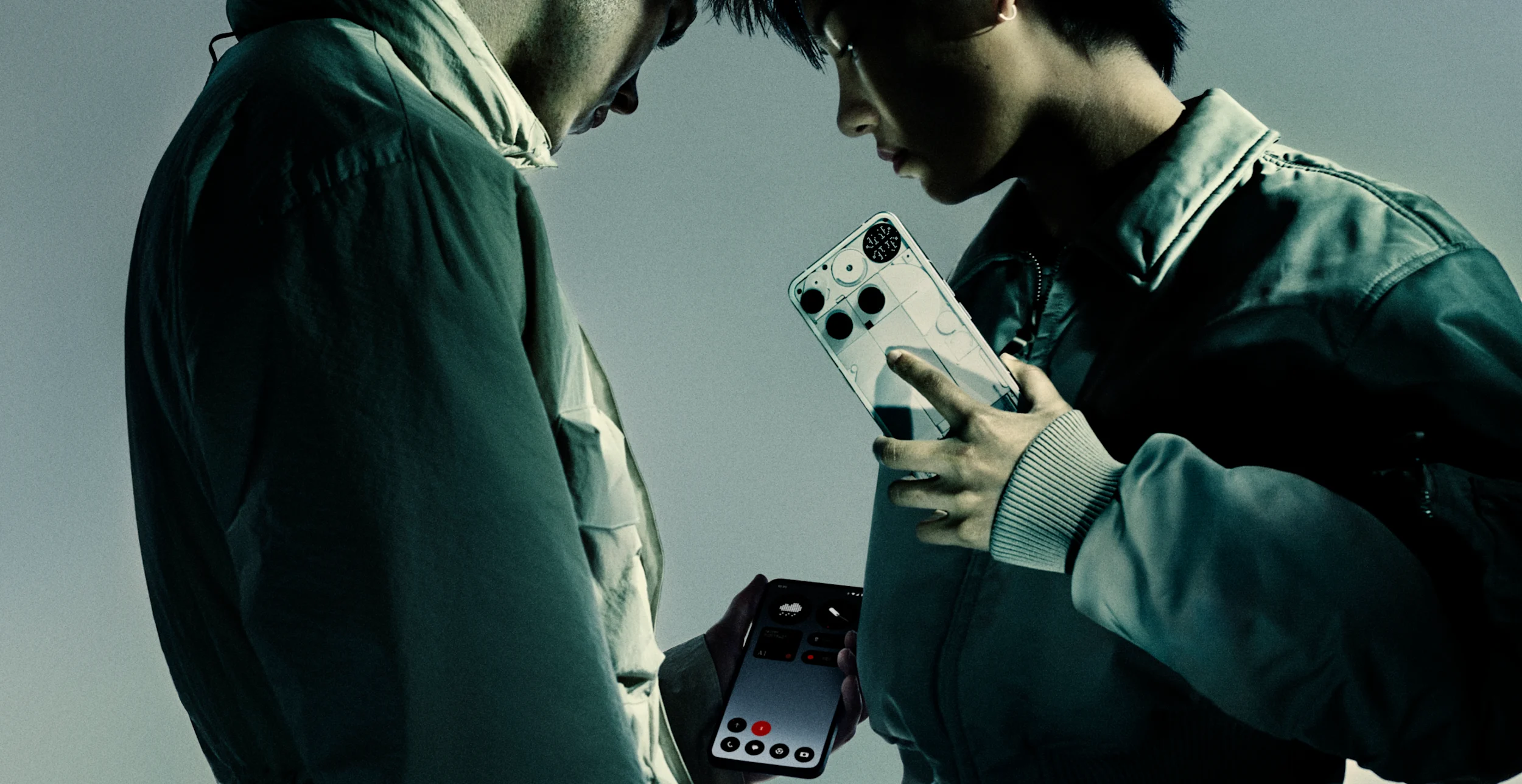 Image of two men holding the Nothing phone 3