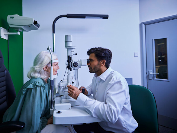 Women using a slit lamp