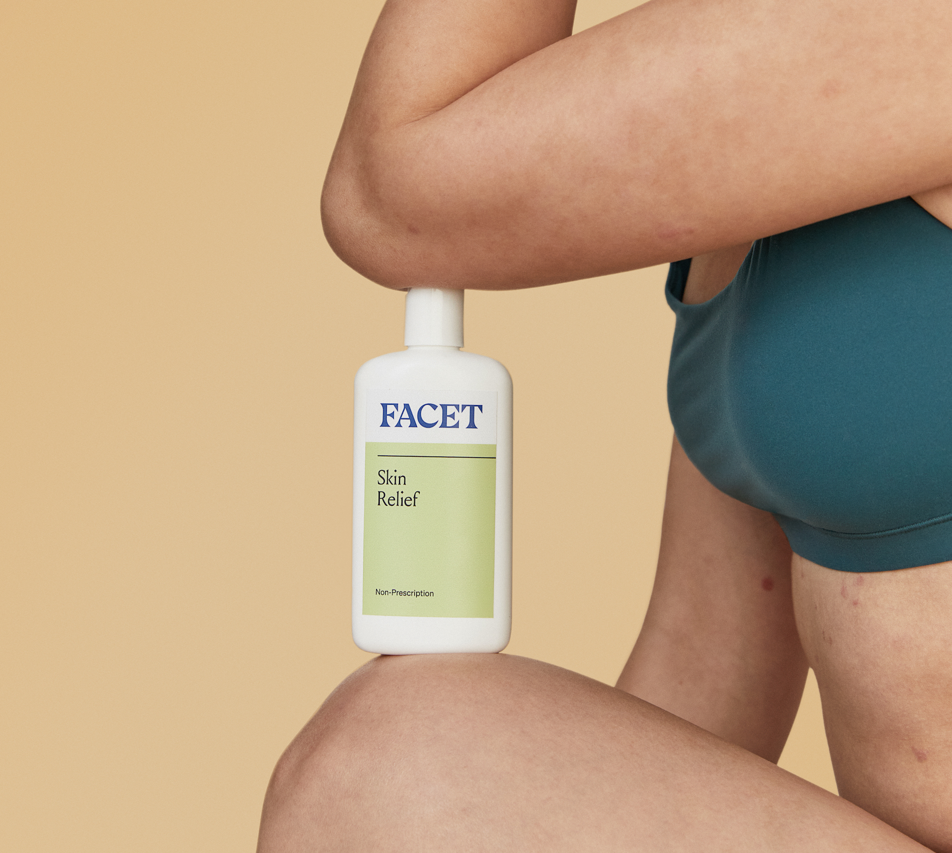 A photo of a person holding Facet Skin Relief.