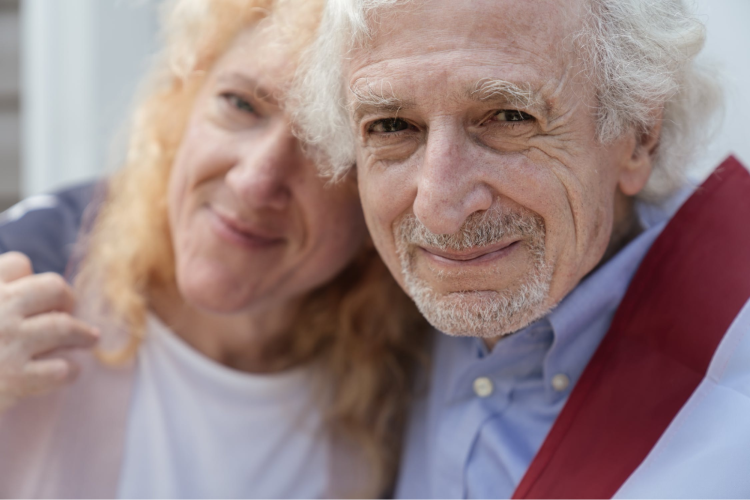 An elderly couple happy because their in-home physical therapy is covered by Medicare.