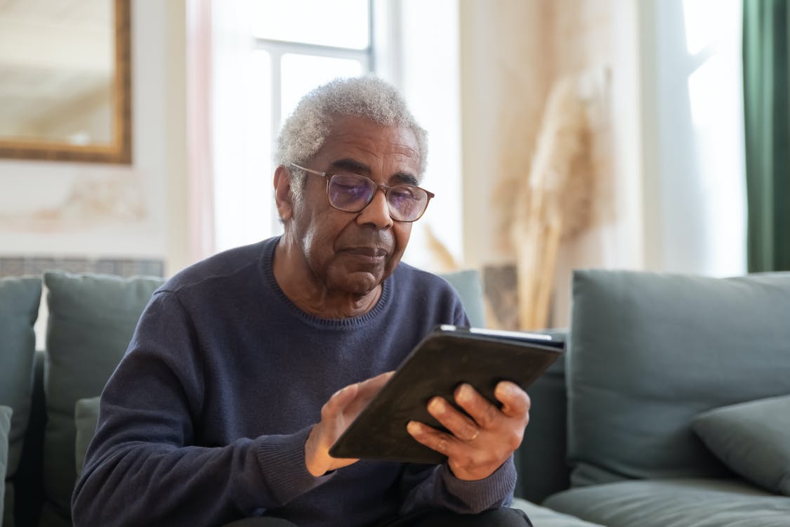 An elderly man reviewing his Medicare Supplement Plan F