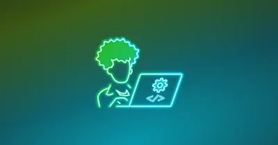 An icon of a software developer in front of a desktop.