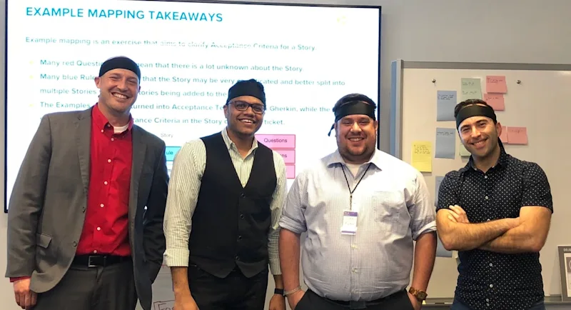 Four Liatrio Dojo coaches posing for a group photo.