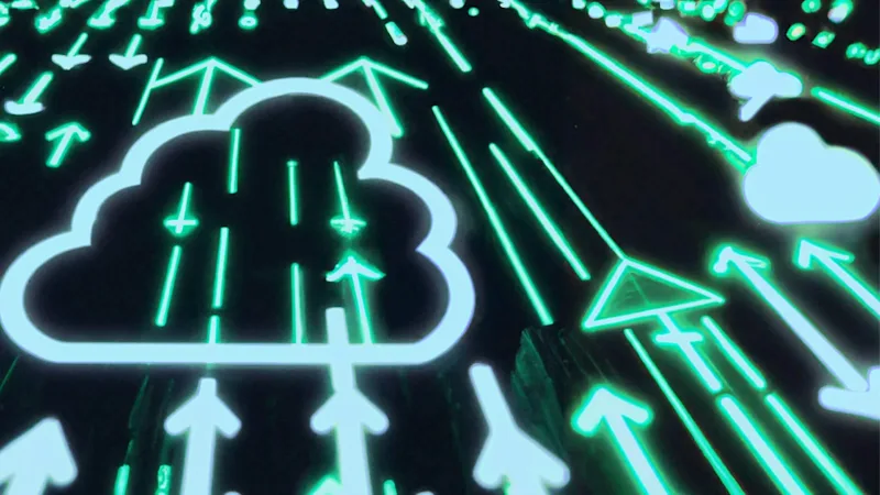 A neon colored abstract photo of digital data moving upward into the digital cloud.