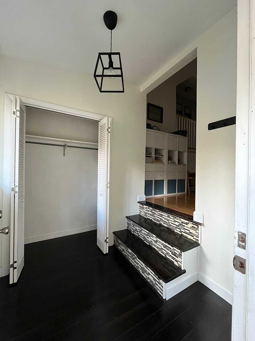 Barkway House - Foyer - Before, BEFORE: Fewer, steeper steps and no handrail made access to the main floor more difficult, while dated flooring and finishes left the entry in need of an update.