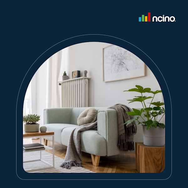 A cozy living room image featuring a white couch and a green plant.