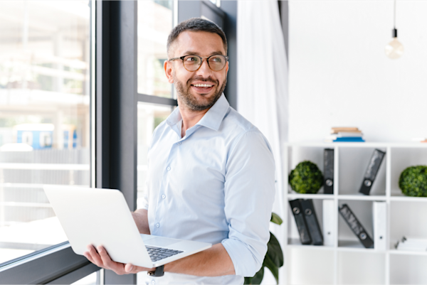 Decorative - A man holding laptop