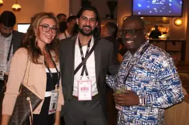 Three people meet at the Money Row networking event at Money20/20 USA.