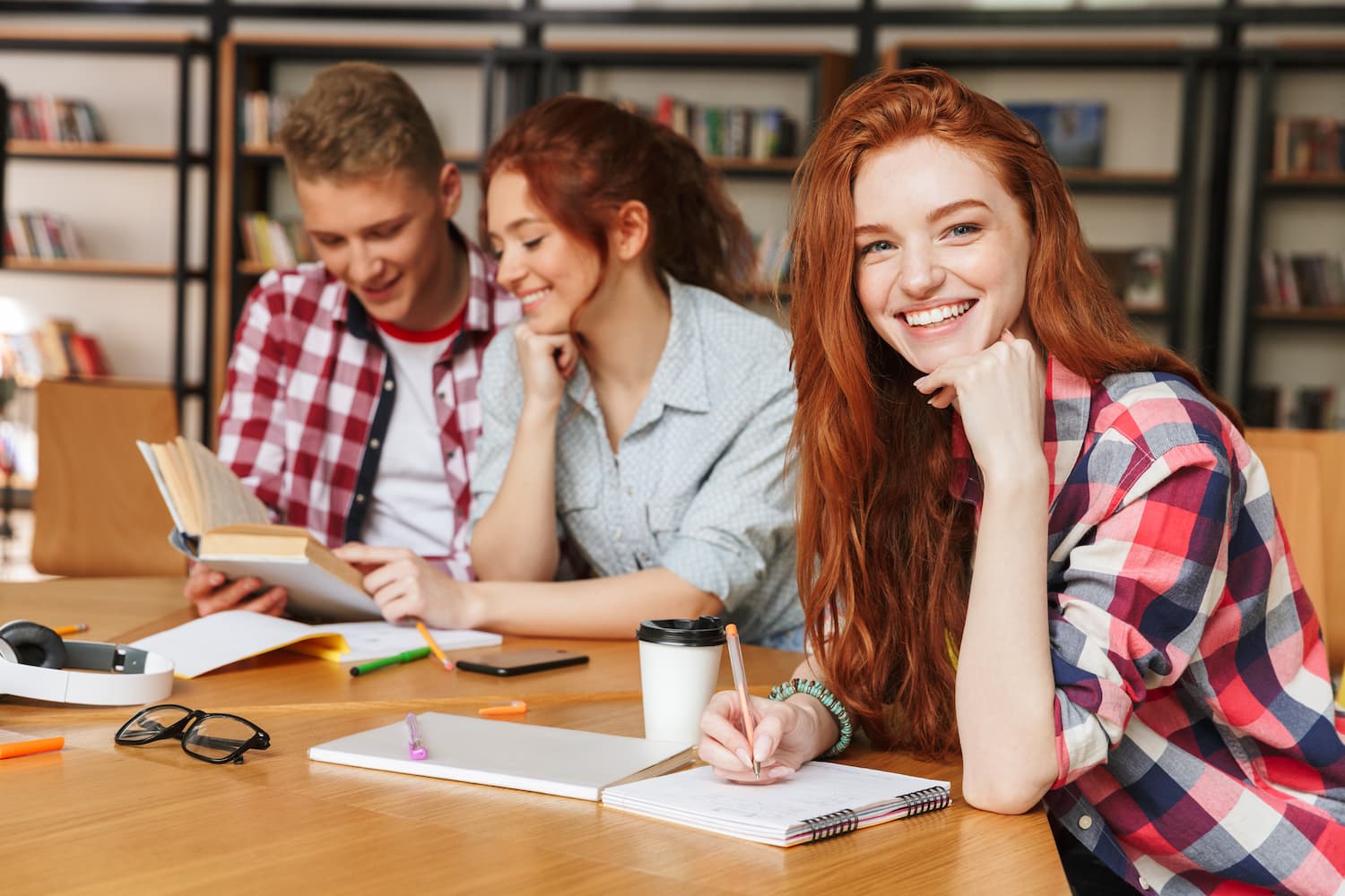 Teenagers can study in the. Two teenagers with a mobile.