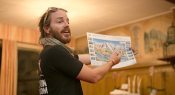 Expat Explore tour leader guide giving directions, summer vacation